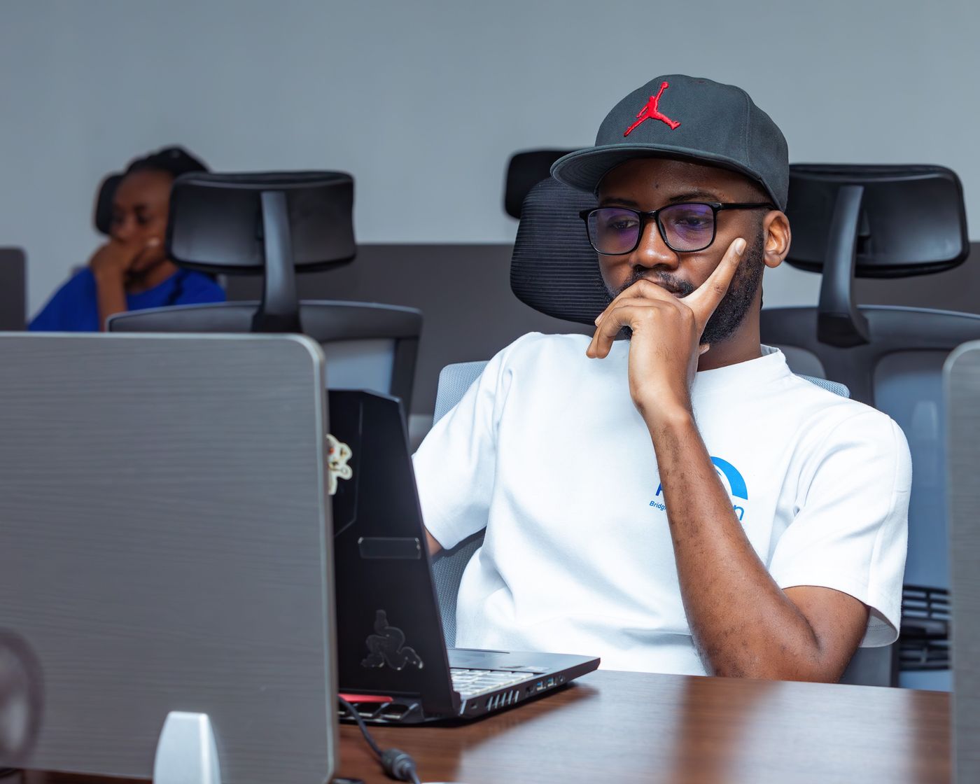 Developer working with AI tools on a laptop